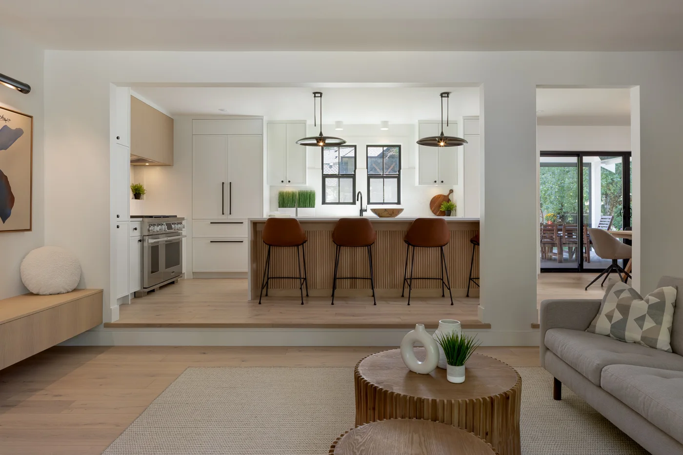 Open kitchen and living room in the Crescent Beach Revival renovation by Venture Pacific